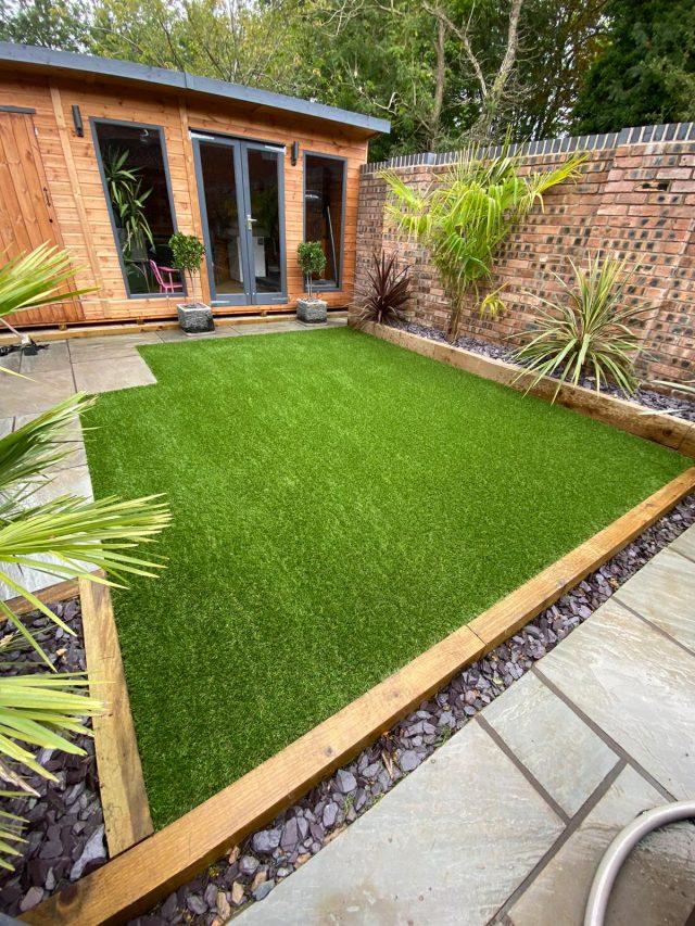 Artificial grass with summer house.