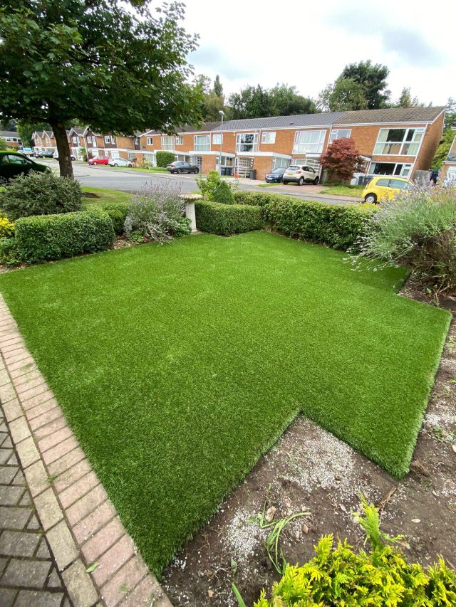 Artificial grass front garden.